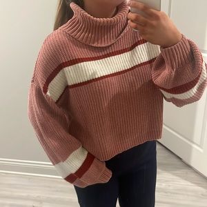 pink and red striped turtleneck sweater